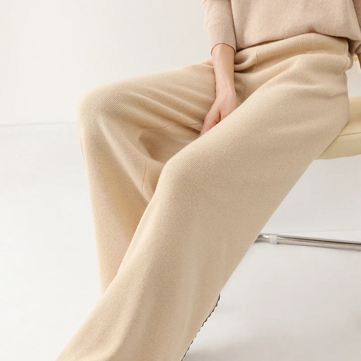 Full outfit view of cream wide-leg Merino Pants paired with fitted knit top