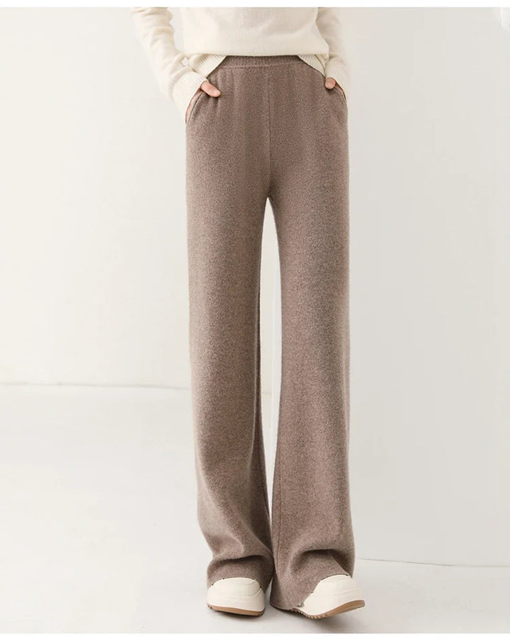 Full-length view of cream Merino Pants showing wide-leg cut and natural movement