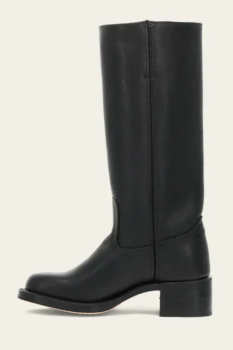 Detail of women's mid-calf boots block heel and sole construction with stacked effect