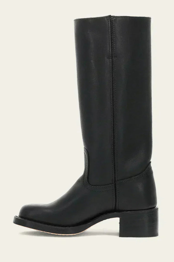 Detail of women's mid-calf boots block heel and sole construction with stacked effect