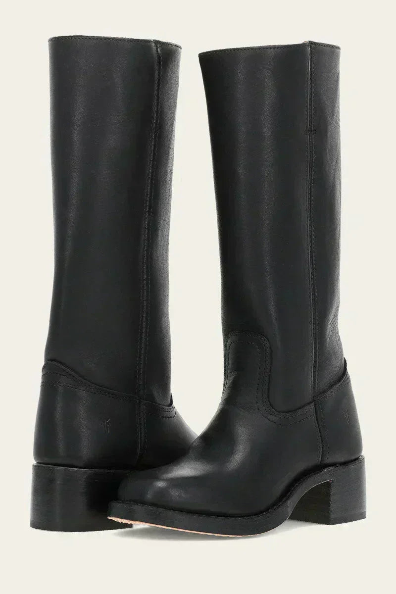 Close-up of women's mid-calf boots highlighting contrast stitching and smooth upper finish