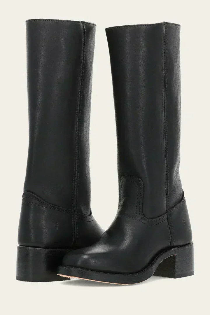 Close-up of women's mid-calf boots highlighting contrast stitching and smooth upper finish