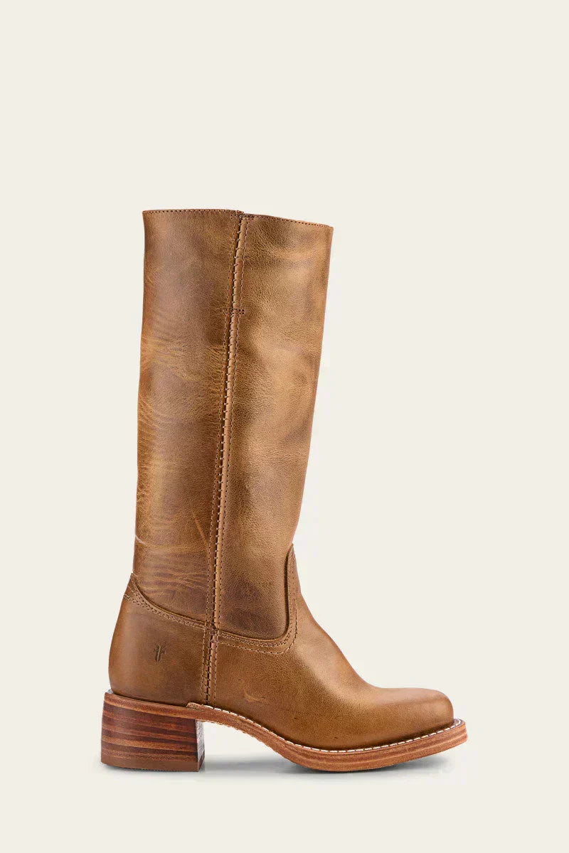 Detail of women's mid-calf boots showing side seam stitching and heel counter design