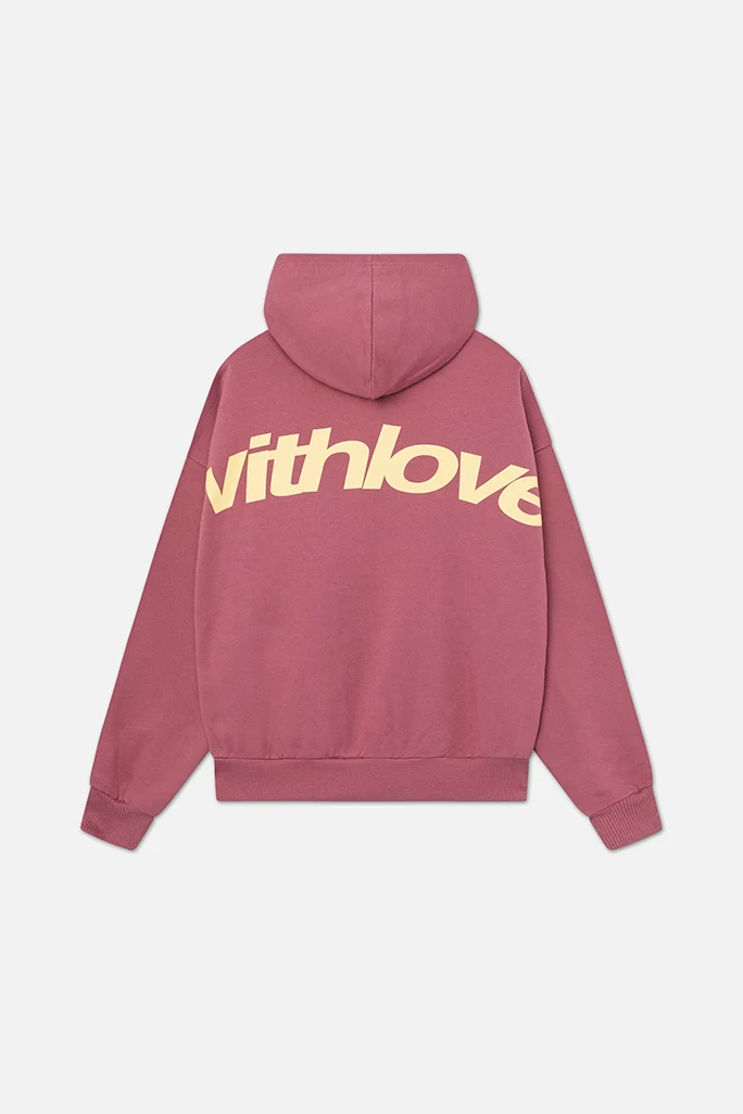 Side view of women's oversized hoodie displaying roomy silhouette and cropped length at waist