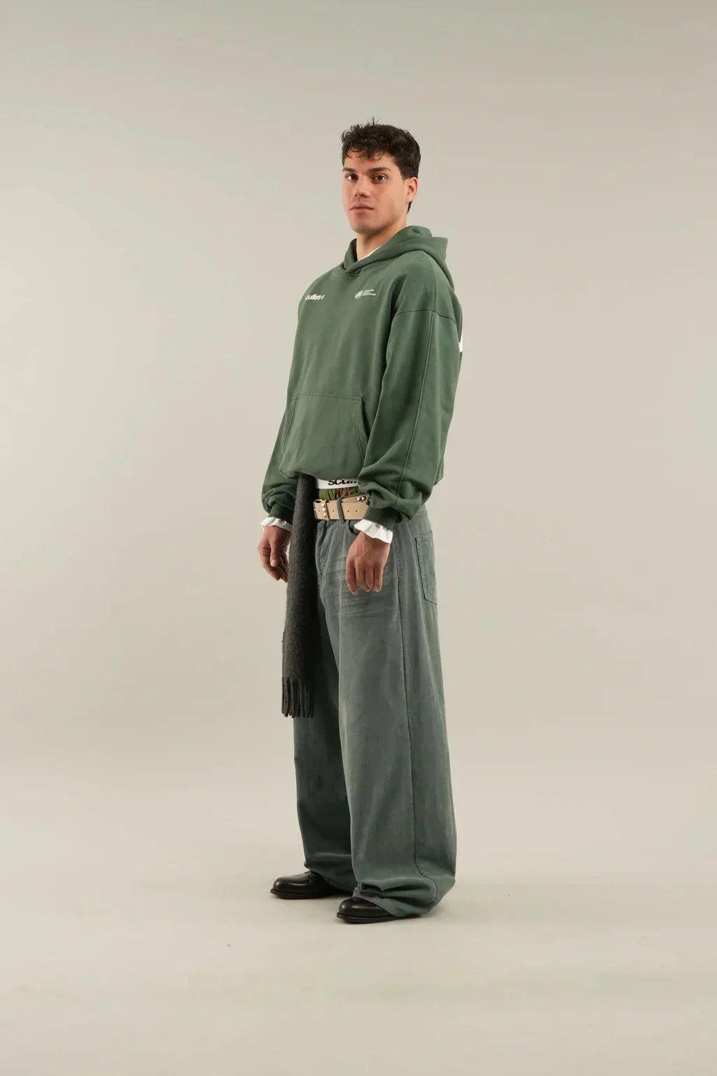 Front view of women's oversized hoodie showing hood drawstring and relaxed drape
