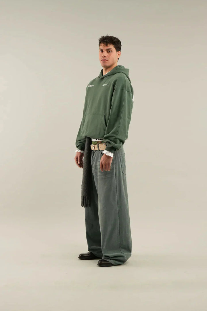 Front view of women's oversized hoodie showing hood drawstring and relaxed drape