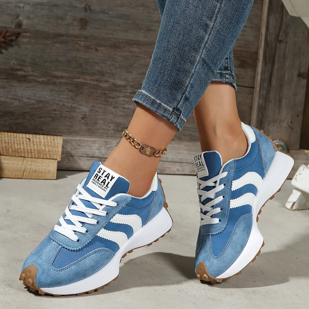 Overhead view of women's retro trainers showing lace-up closure and padded tongue detail