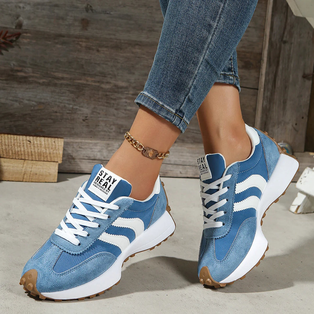 Overhead view of women's retro trainers showing lace-up closure and padded tongue detail