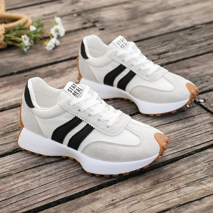 Women's burgundy trainers with gum rubber traction outsole and padded collar for comfort