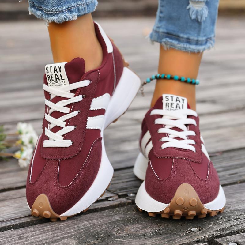 Women's burgundy running trainers with chunky midsole and gum rubber outsole for grip