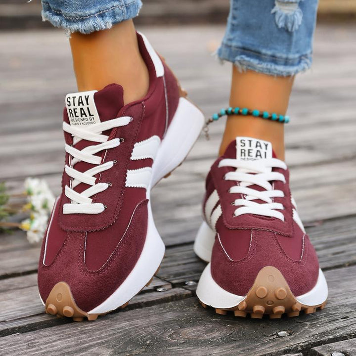 Women's burgundy running trainers with chunky midsole and gum rubber outsole for grip