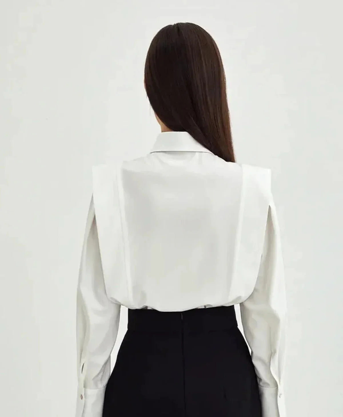 Side view of women's white shirt showing tailored fit and crisp pointed collar