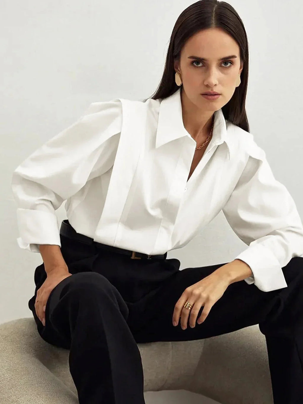 Back view of women's white collared shirt with clean construction and structured shoulders