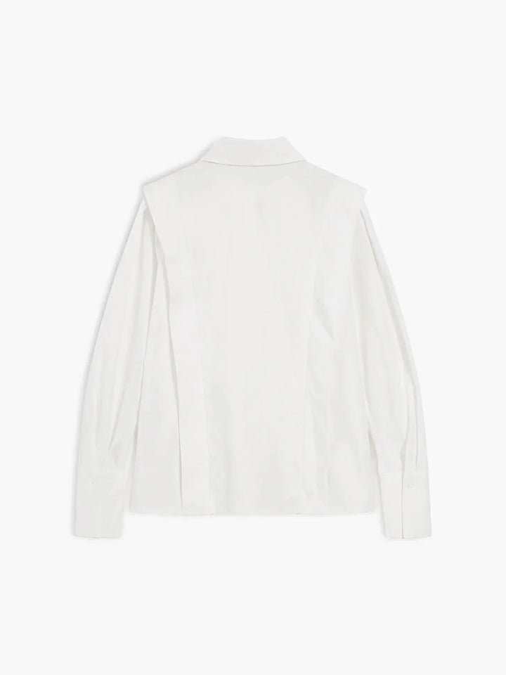 Women's white collared shirt showing pleated shoulder construction and tailored silhouette