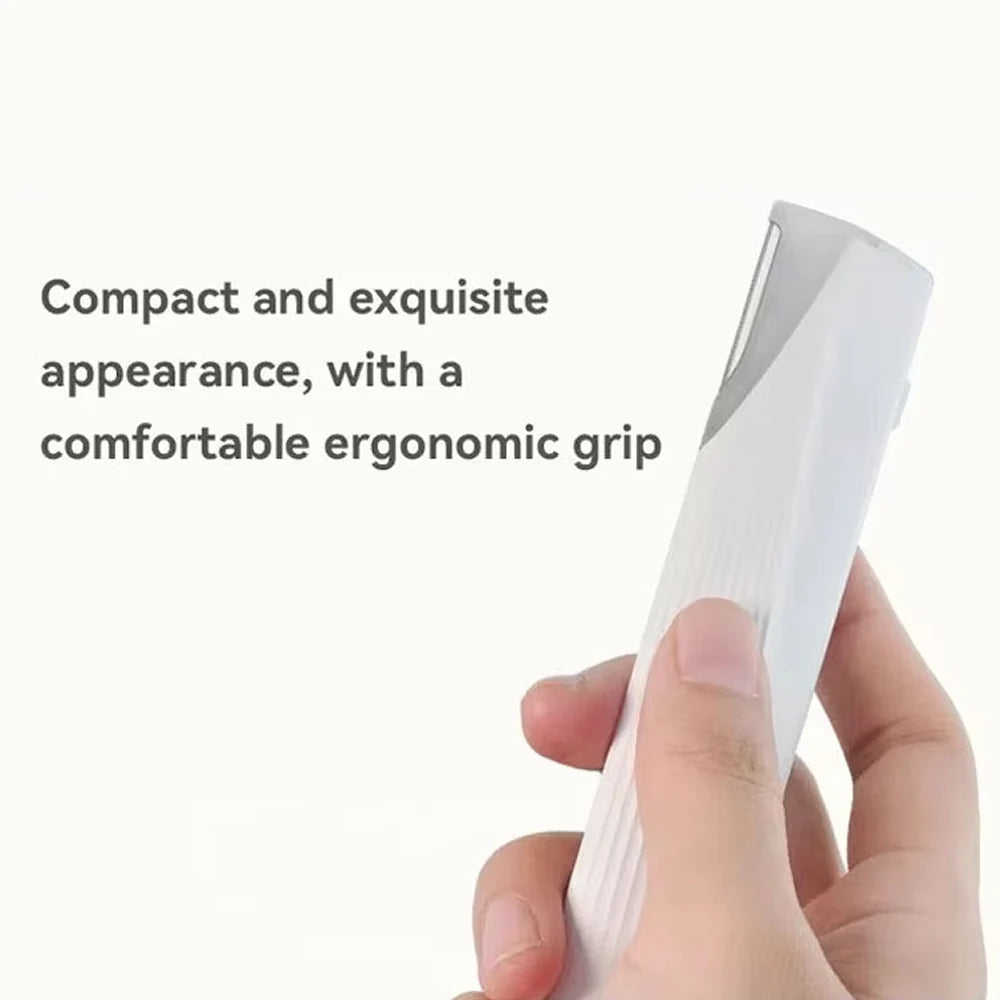 Dermaplaning tool with LED lighting illuminated showing ergonomic grip design and blade attachment detail