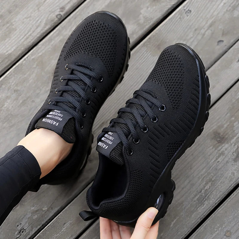 Close-up of men's trainers with textured knit mesh upper and lace-up closure