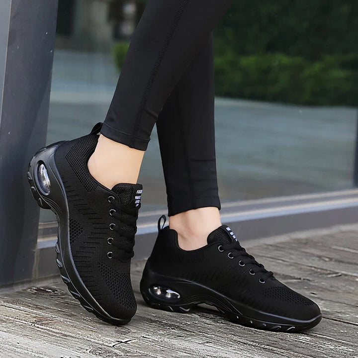 Rear view of men's air cushion trainers with pull tab and padded collar
