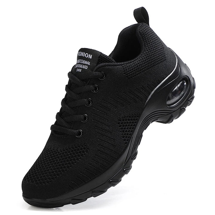 Men's red trainers with shock-absorbing sole and breathable mesh construction