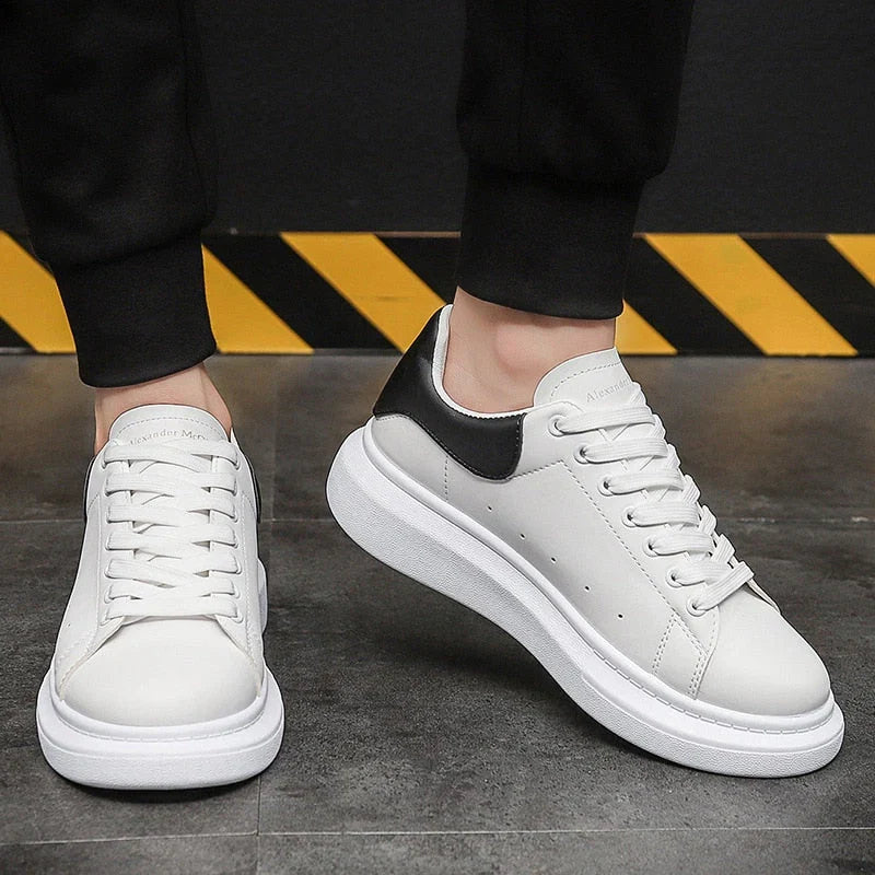 Close-up of men's platform trainers featuring smooth upper and padded collar construction