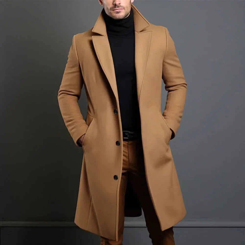 Close-up view of men's tailored overcoat showing structured fabric and welt pocket detail