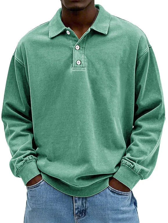 Close-up of men's polo shirt collar and button detail in soft fabric