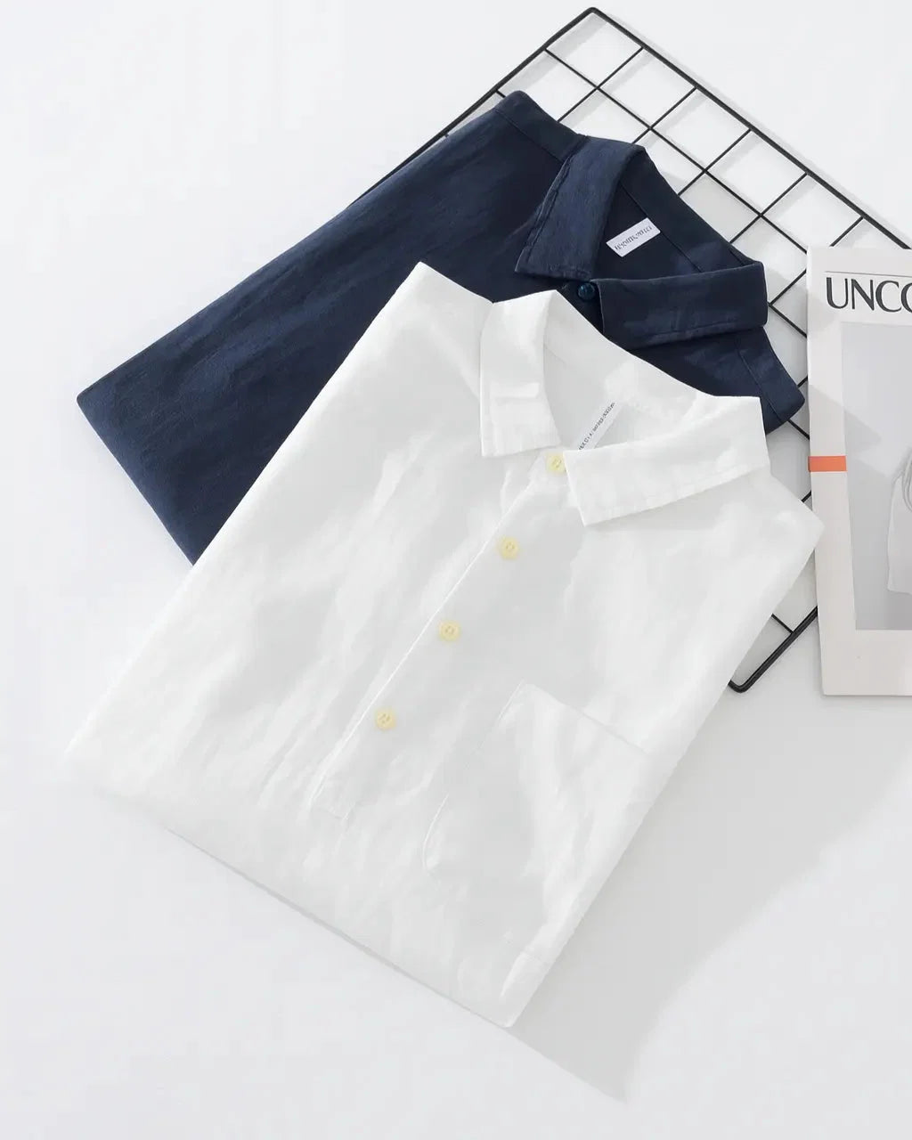 Detail of chest patch pocket on men's navy popover shirt with natural texture