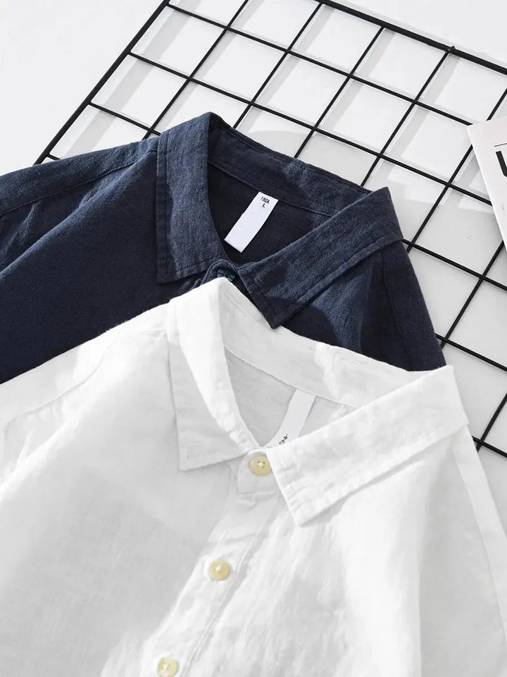 Men's long sleeve popover shirt styled over white tee showing relaxed fit and drape