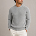 Men's ribbed knit jumper in grey with crew neck and raglan sleeves worn with cream trousers
