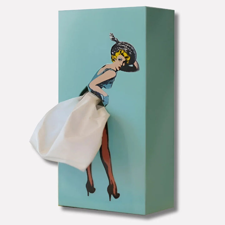 Collection of vintage pop-art tissue box holders in various colours on bookshelf display