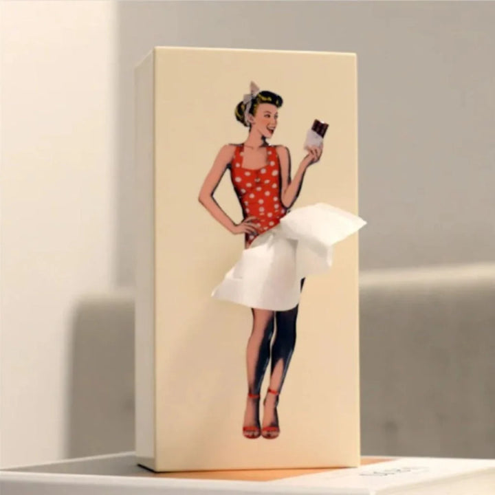 Pink retro tissue holder with vintage illustration showing animated skirt movement next to candles