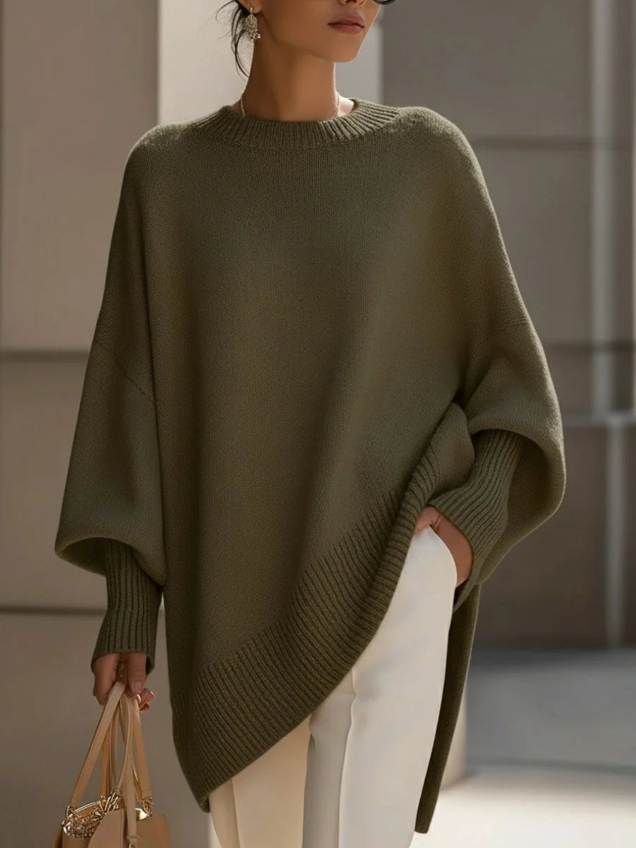 Women's oversized knit jumper in beige paired with cream trousers for casual outfit