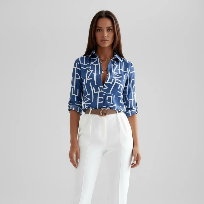 Women's printed shirt showing roll-up sleeve tab detail and button front closure