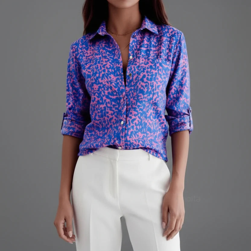 Full outfit featuring printed shirt with tailored white trousers and belt styling