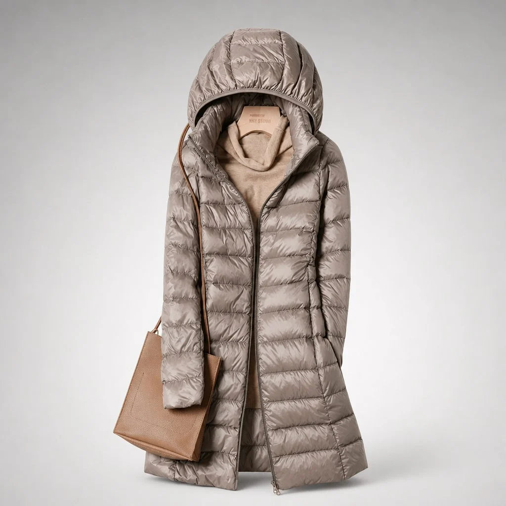 Women's puffer coat in light pink showing smooth shell finish and horizontal quilted panels