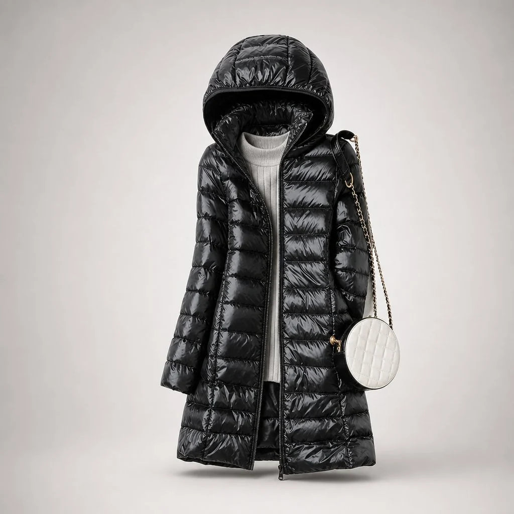 Full-length view of women's longline puffer coat with detachable hood and zip closure