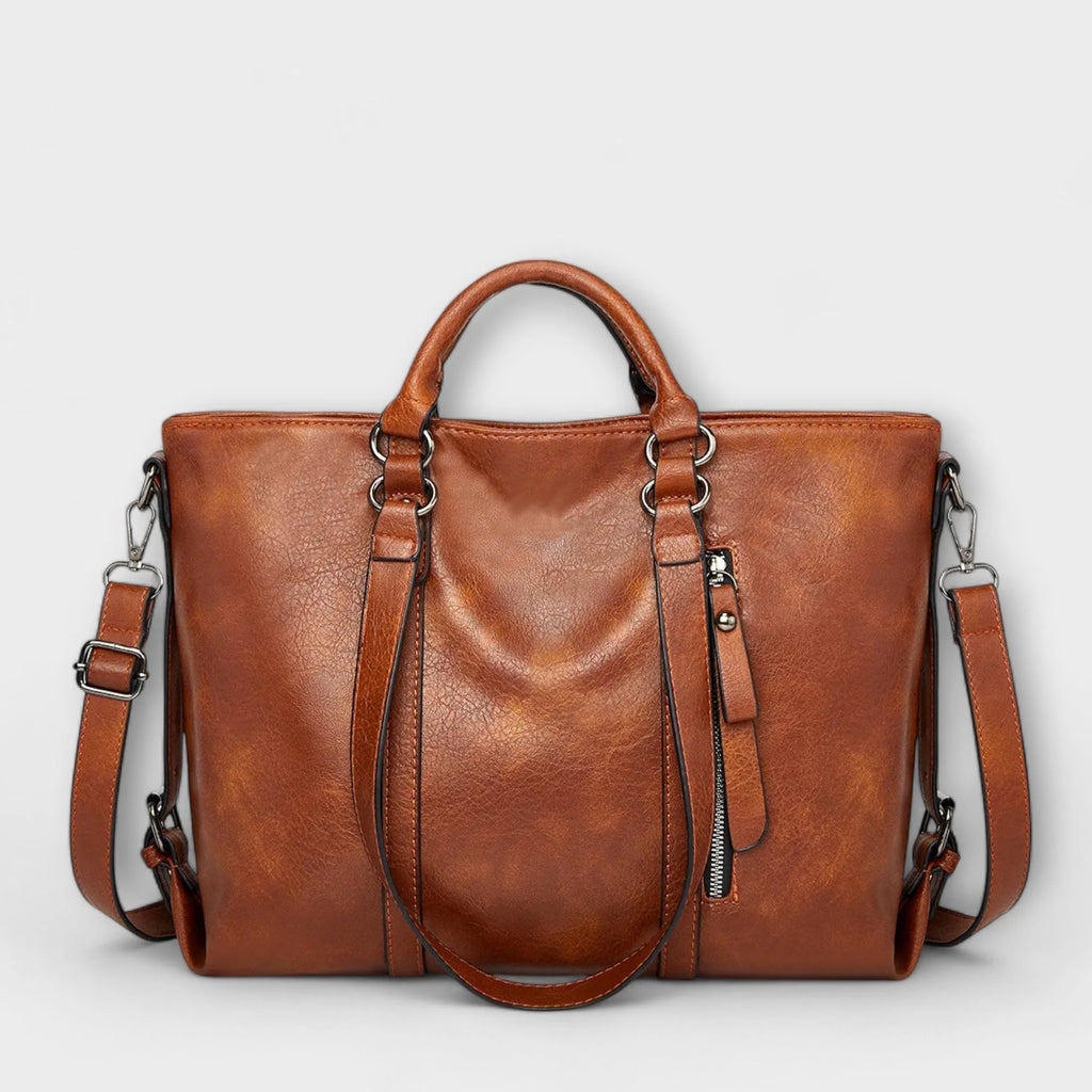 Women's structured tote bag in tan with dual handles and adjustable shoulder strap