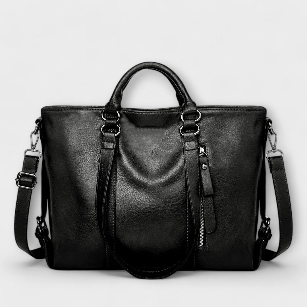 Front view of women's tote bag showing smooth finish and decorative zip detail