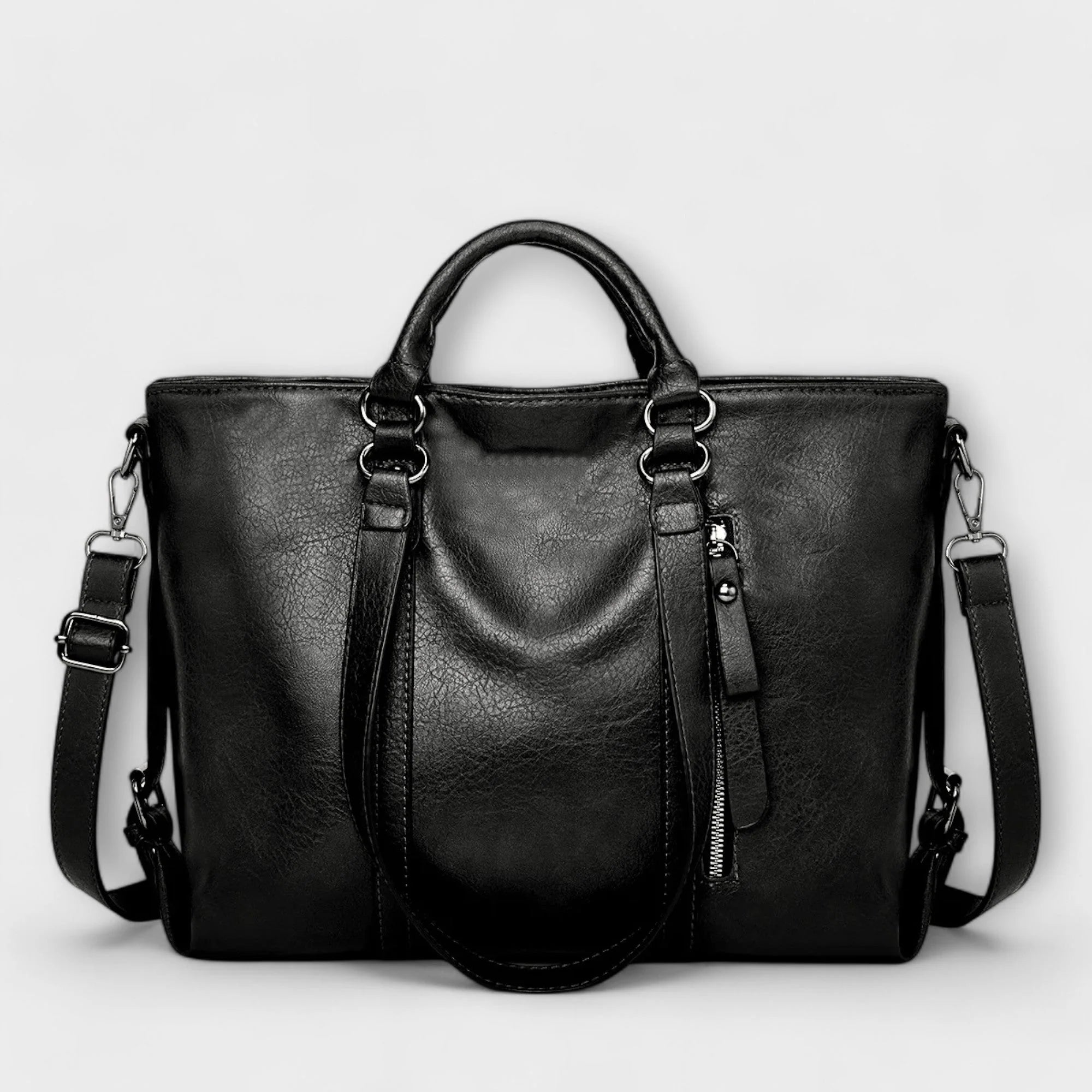 Front view of women's tote bag showing smooth finish and decorative zip detail