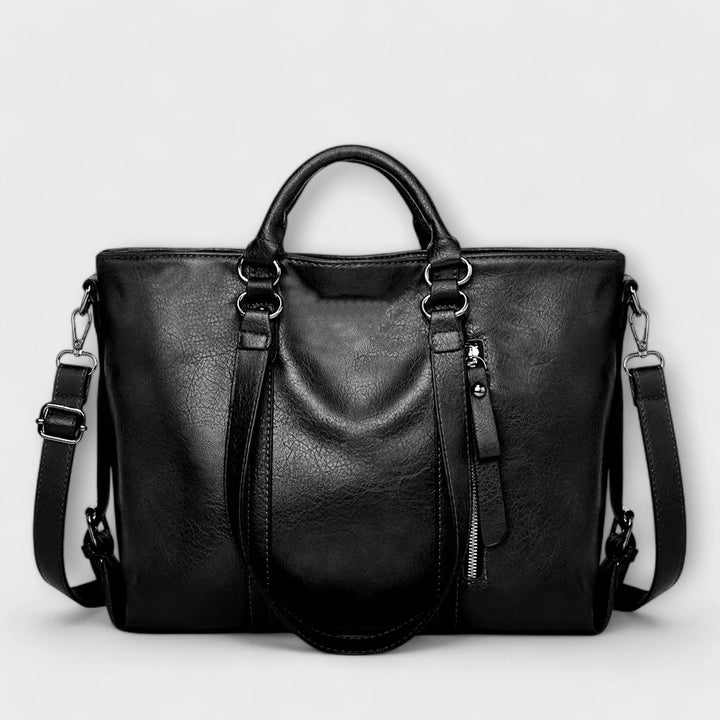 Front view of women's tote bag showing smooth finish and decorative zip detail
