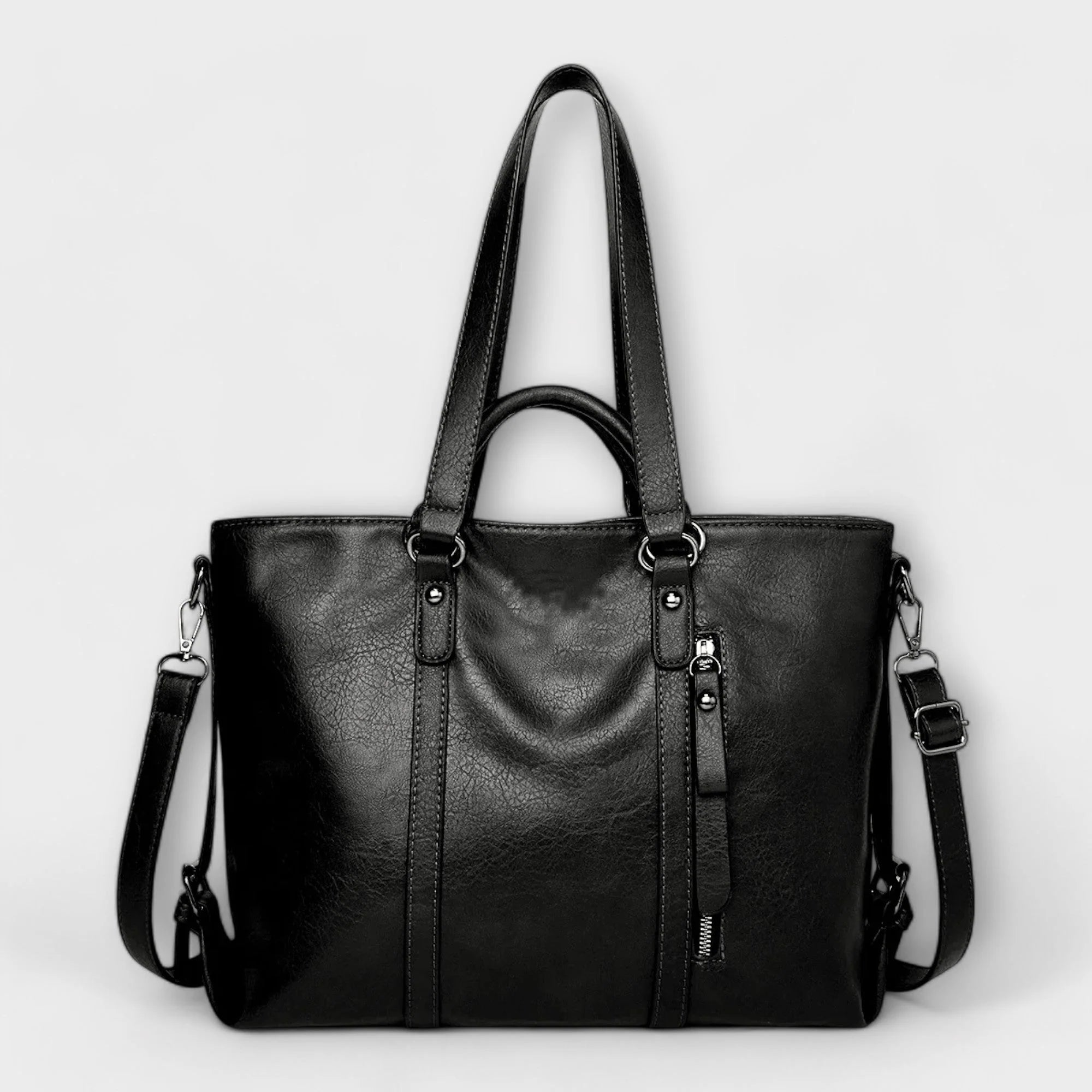 Side angle of structured handbag displaying spacious silhouette and reinforced base