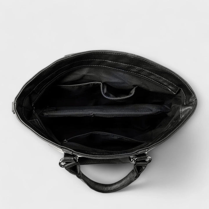 Back view of women's structured tote bag with adjustable shoulder strap