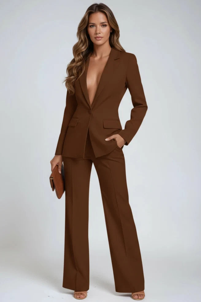 Full-length studio shot of women's tailored blazer and wide-leg trouser suit set