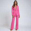Side view showing wide-leg trouser silhouette and blazer length on women's two-piece suit