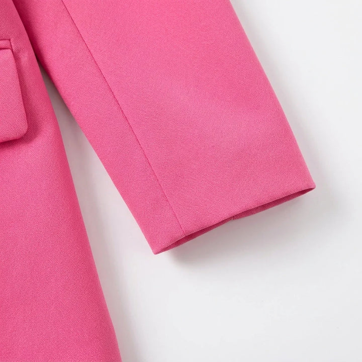 Back view of women's tailored blazer showing structured shoulders and centre vent detail