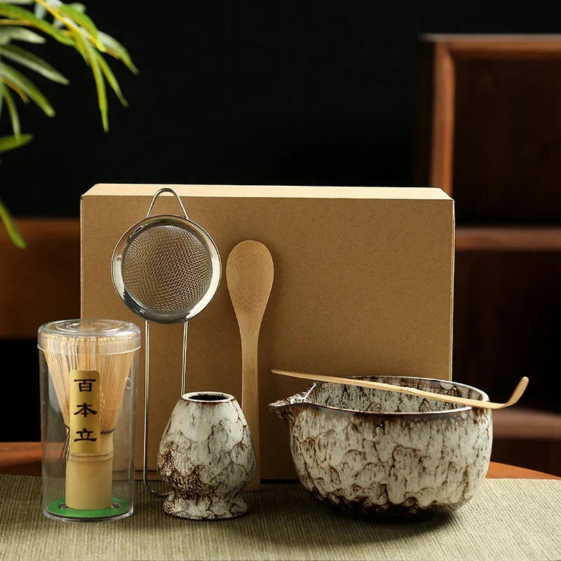 Close-up of handcrafted bamboo whisk and ceramic holder from matcha tea set