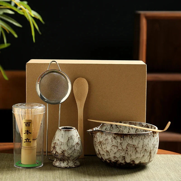 Close-up of handcrafted bamboo whisk and ceramic holder from matcha tea set