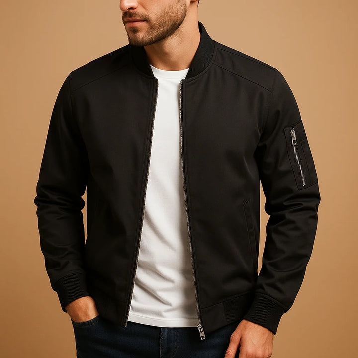 Close-up view of men's olive bomber jacket showing ribbed collar detail and smooth fabric finish