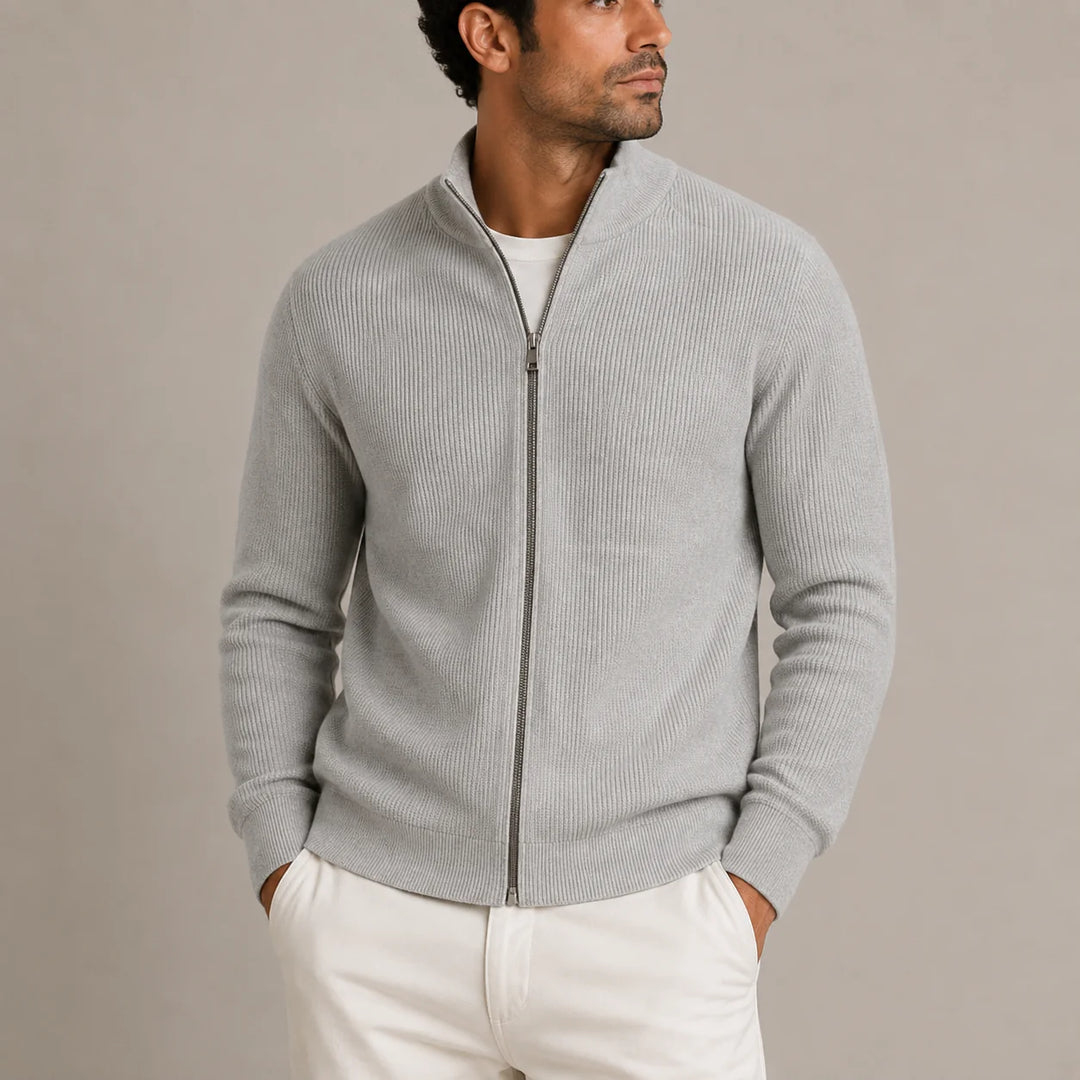 Close-up view of men's ribbed cardigan showing full metal zip and stand collar detail