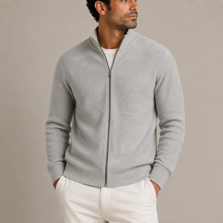 Close-up view of men's ribbed cardigan showing full metal zip and stand collar detail