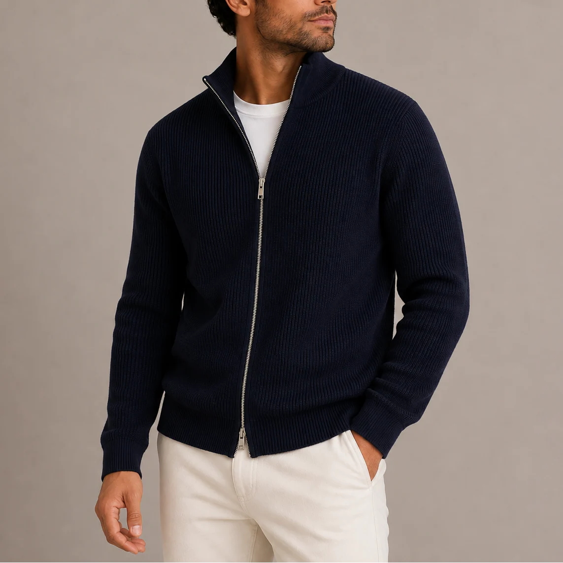 Men's ribbed cardigan worn with light trousers showing versatile smart-casual styling option